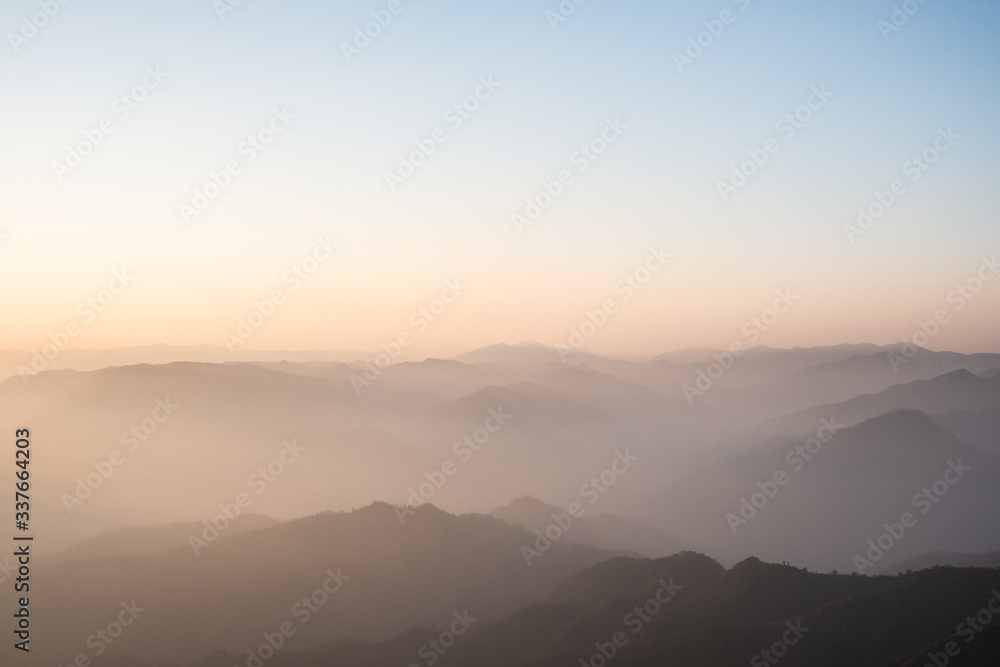 Twilight, sunrise and sea of fog in the morning on the mountains of northern Thailand, during the rainy season. Twilight, sunrise and sea of fog in the morning on the mountains of northern Thailand, during the rainy season.