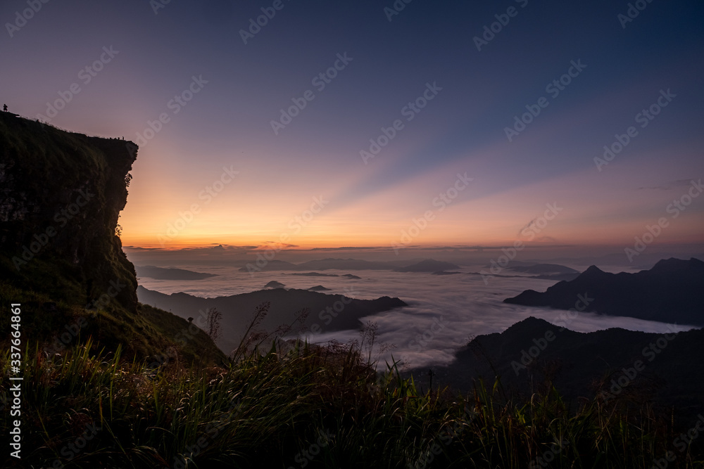 Twilight, sunrise and sea of fog in the morning on the mountains of northern Thailand, during the rainy season.