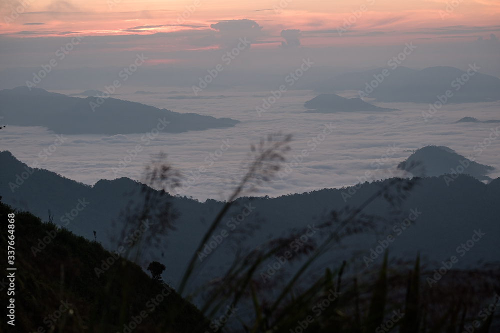Twilight, sunrise and sea of fog in the morning on the mountains of northern Thailand, during the rainy season.