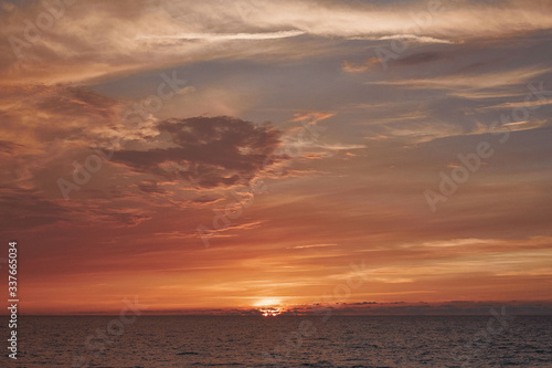 Stunning colorful sunset on a sandy beach. © Andrey Dydykin