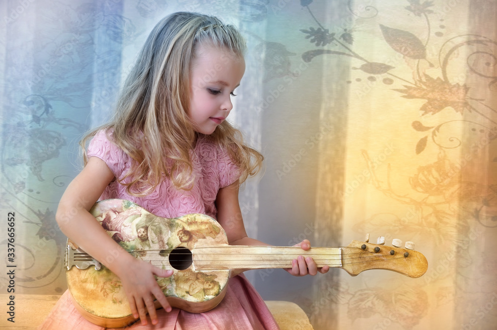 Cute little blonde girl in a pink dress with curls with a vintage ...