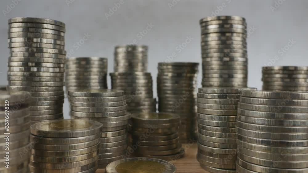 Coins stack, real estate, and bank saving concepts