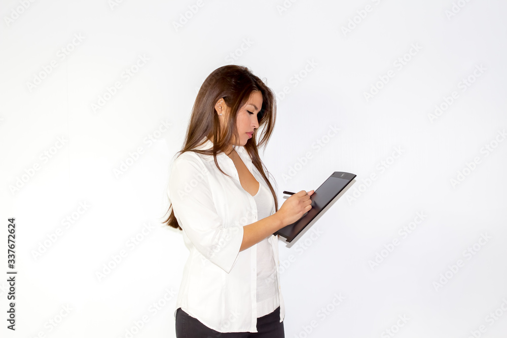 Beautiful Latina Girl writes on a blackboard table Beautiful Latina Girl writes on a blackboard table