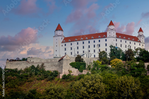 Evening view of the old famous Bratislava Castle up on the hill with surrounding wall.
