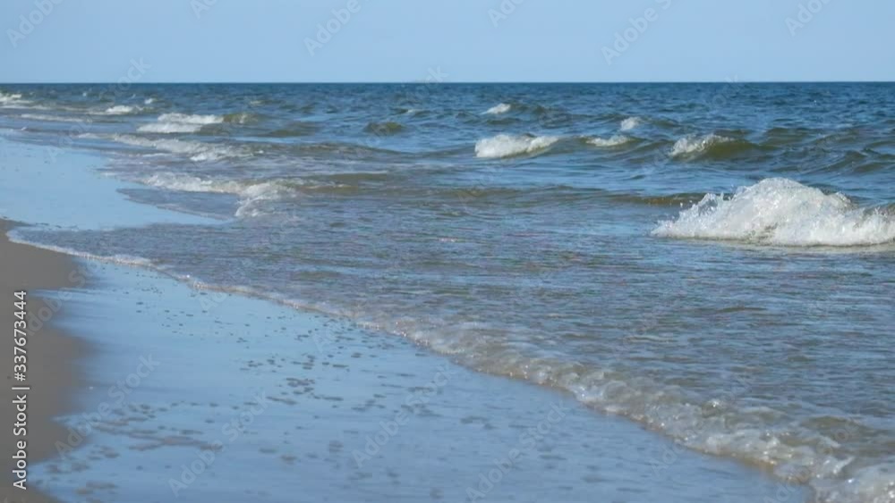 Sea surf. Sea waves smoothly roll onto the sandy shore. Black Sea Sea surf. Sea waves smoothly roll onto the sandy shore. Black Sea