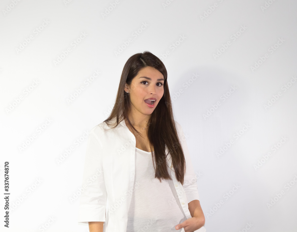 Surprised hispanic woman on white background Surprised hispanic woman on white background