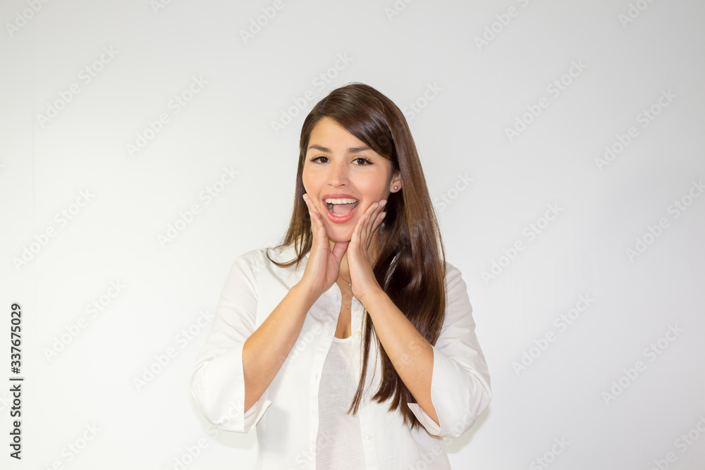 Surprised hispanic woman on white background Surprised hispanic woman on white background
