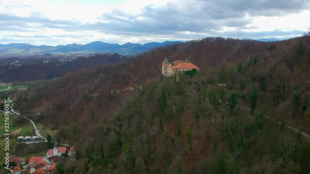 Baroque style Podcetrtek castle on top of a hill standing out from the forest Baroque style Podcetrtek castle on top of a hill standing out from the forest