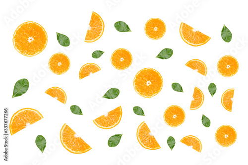 Fresh orange slices and green leaf on white background.