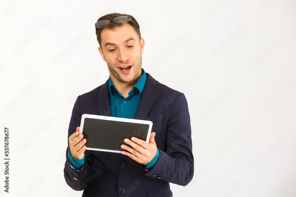 A view of a shocked young businessman isolated on white background A view of a shocked young businessman isolated on white background