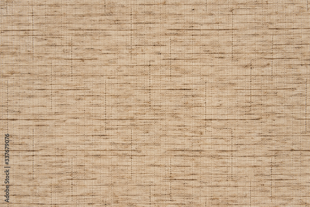 The texture of the canvas. Beige fabric close-up.