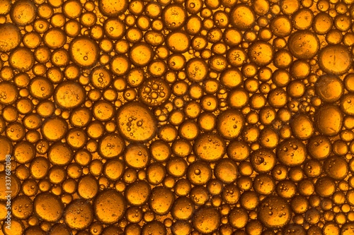Golden Yellow Bubble Oil Droplet, Abstract Background. macro shot
