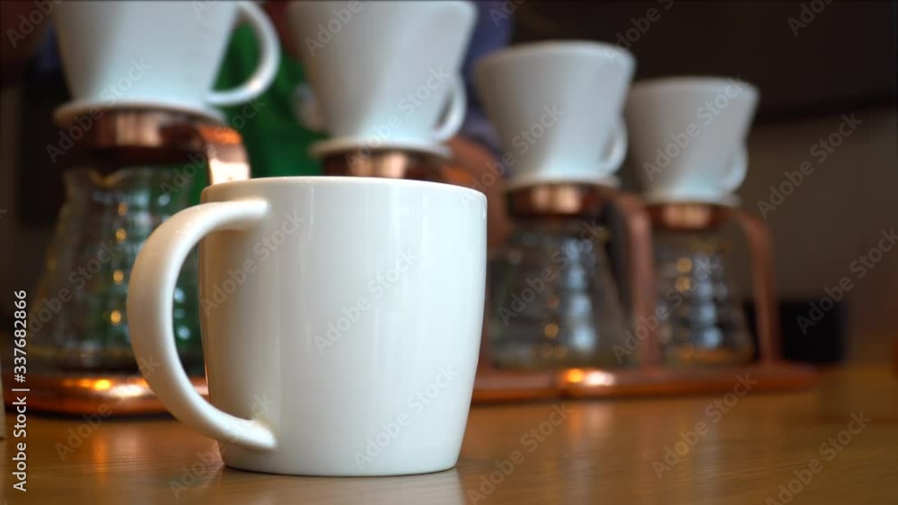 How to making coffee drip with hot water, roasted coffee beans on filter, Hot water pouring to roasted coffee for fresh drip coffee. Industrial food and drink concept. How to making coffee drip with hot water, roasted coffee beans on filter, Hot water pouring to roasted coffee for fresh drip coffee. Industrial food and drink concept.