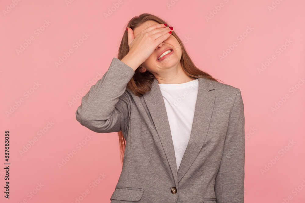 Don't want to look! Portrait of displeased young woman in business suit covering eyes with hand, her face expressing disgust gross shame, scared to watch. studio shot isolated on pink background Don't want to look! Portrait of displeased young woman in business suit covering eyes with hand, her face expressing disgust gross shame, scared to watch. studio shot isolated on pink background