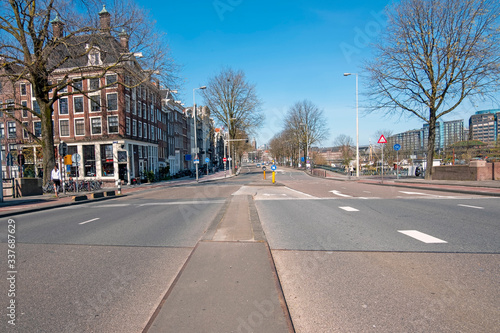 Empty Prins Hendrikkade in the center of Amsterdam during the Corona crisis