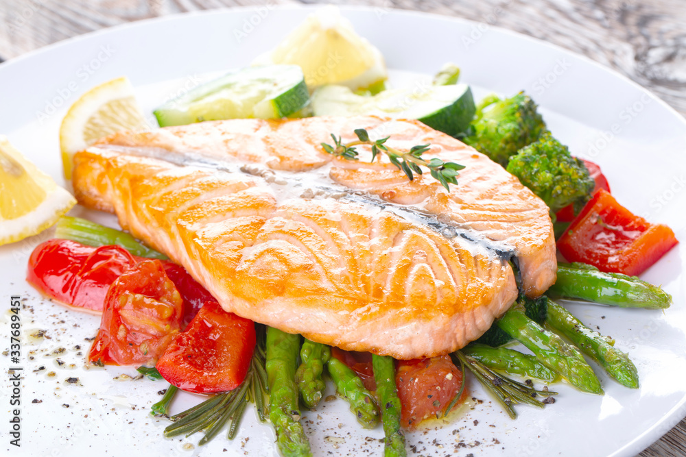 Grilled salmon steak butterfly with vegetables Grilled salmon steak butterfly with vegetables