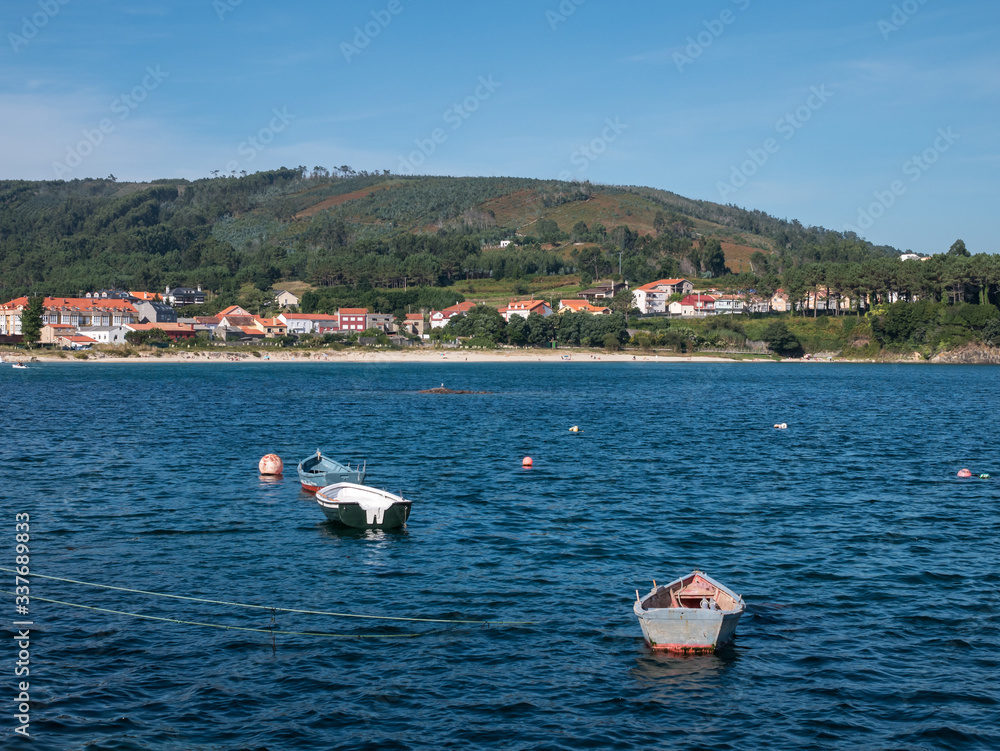 View over Sardineiro do Abaixo, its beach and some small fishing boats, Fisterra, Galicia, Spain