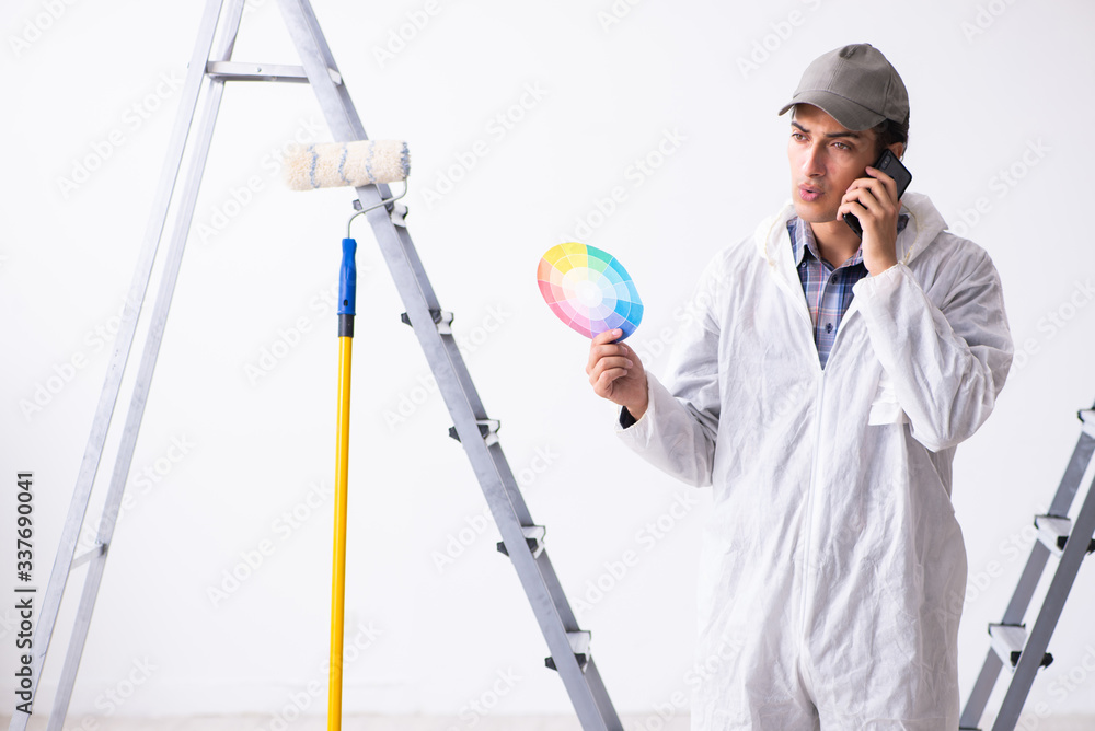 Painter working at construction site Painter working at construction site