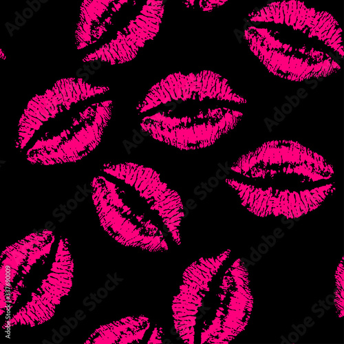 Seamless pattern with a magenta lipstick kiss prints on black background. Vector design for textile; backgrounds; clothes; web sites and wallpaper. Fashion illustration seamless pattern.