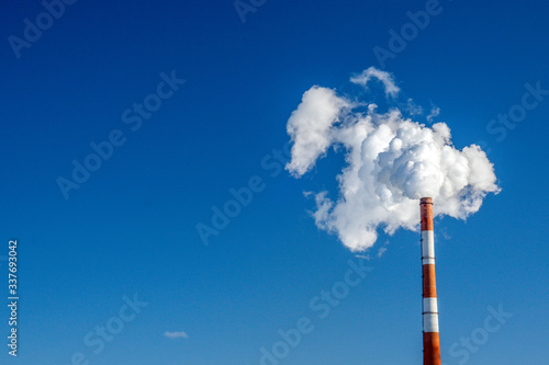 Stampa su tela pipe of white smoke, three in a row in the blue sky