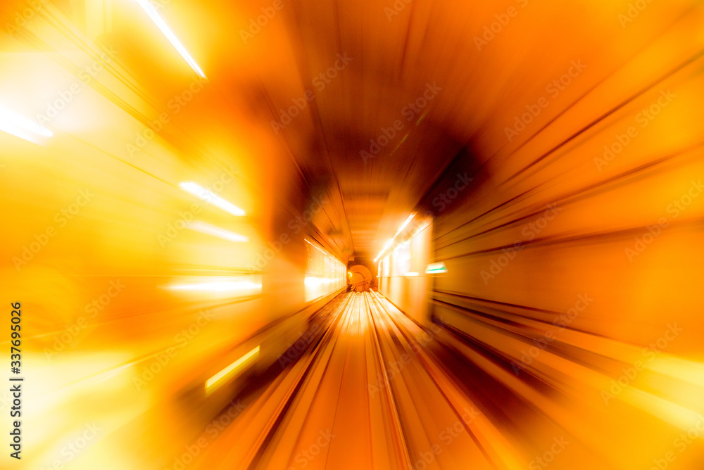 Abstract image of motion blurred tracks and subway tunnel in Copenhagen, Denmark. (high-speed technology - concept)