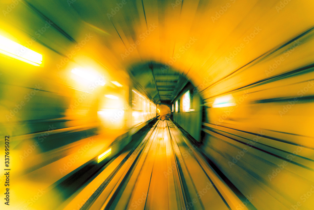 Abstract image of motion blurred tracks and subway tunnel in Copenhagen, Denmark. (high-speed technology - concept)