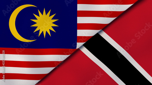 The flags of Malaysia and Trinidad and Tobago. News, reportage, business background. 3d illustration