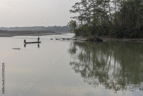 Fisherman at Rapti river of Chitwan national park in Nepal
