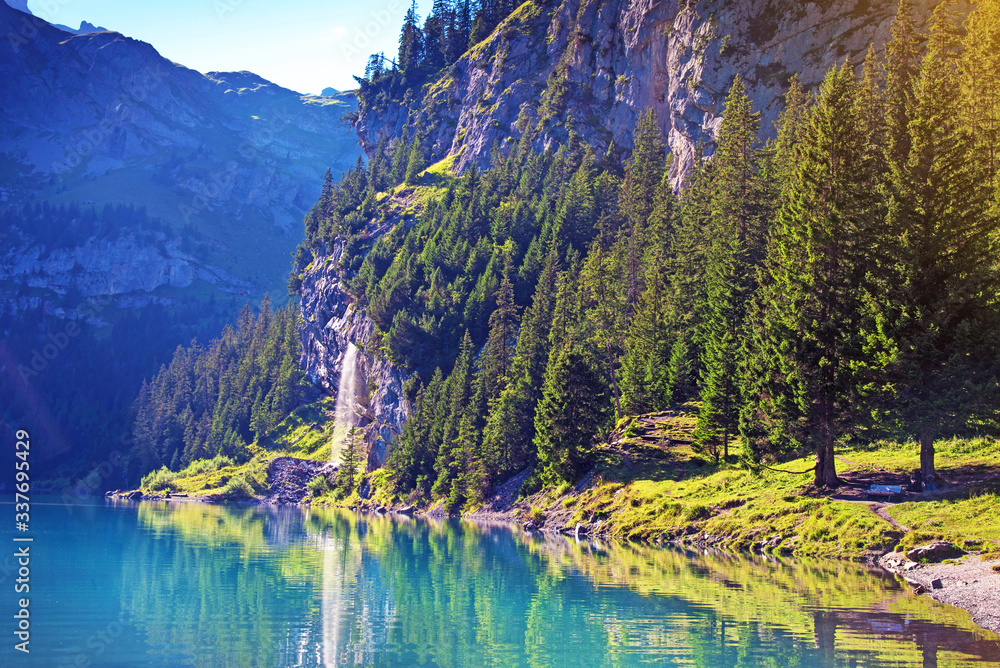 Incredible landscape with a waterfall near Emerald Lake in the Swiss Alps, Europe