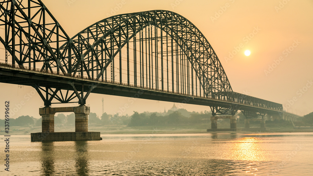 Sunrise at Sagaing bridge spanning over the Irrawaddy river
