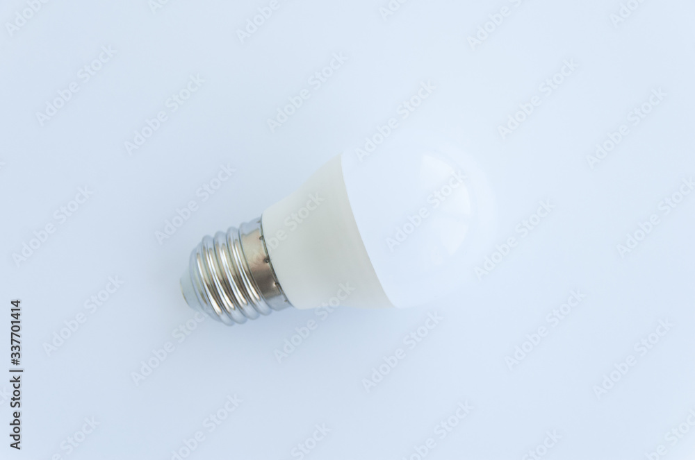 White light bulb isolated on white background. Close up. Top view White light bulb isolated on white background. Close up. Top view