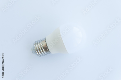 White light bulb isolated on white background. Close up. Top view