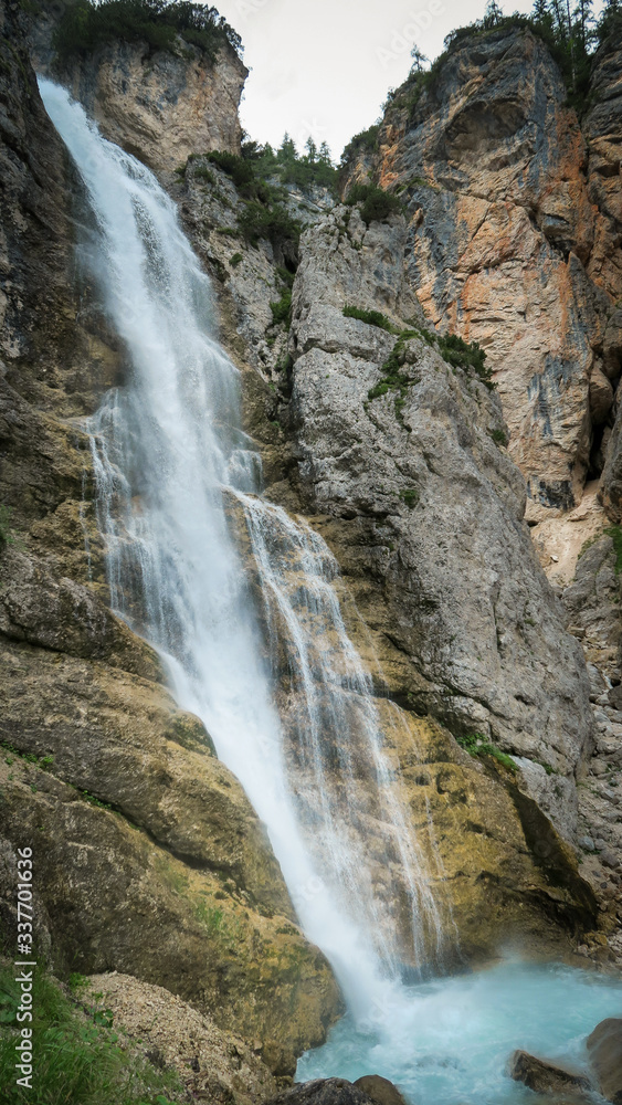 Fototapeta premium Waterfall in the Dolomite Mountains