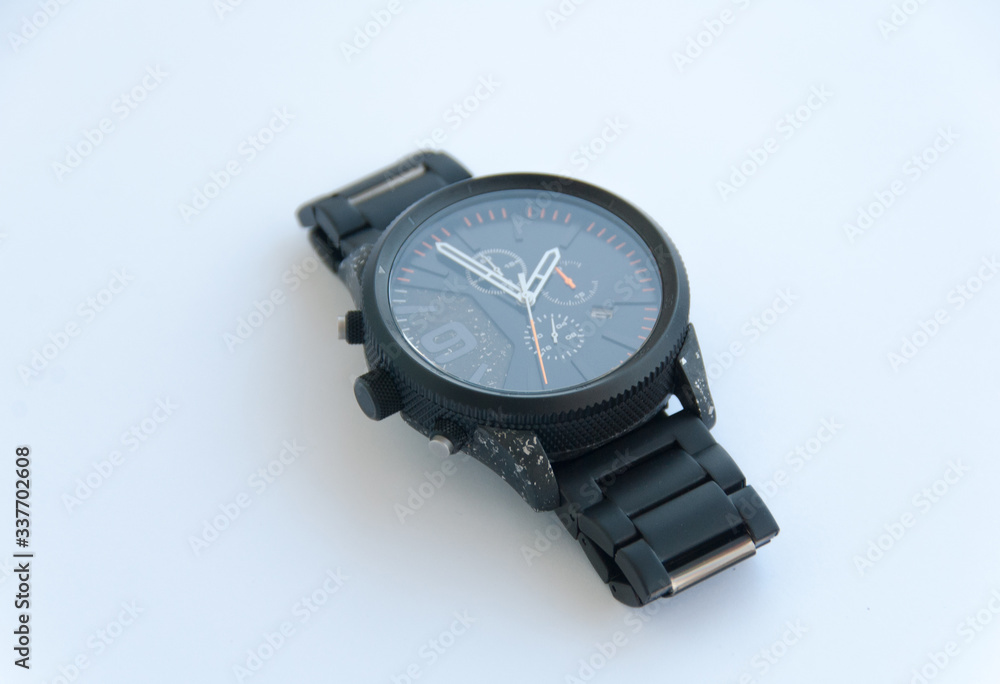 Men black metal watch on white background. Isolated. Close up Men black metal watch on white background. Isolated. Close up