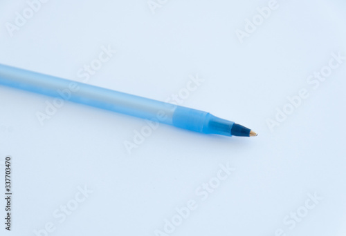 Blue plastic pen isolated on the white background. Close up