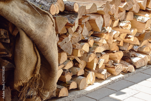 stacked firewood covered with the blanket