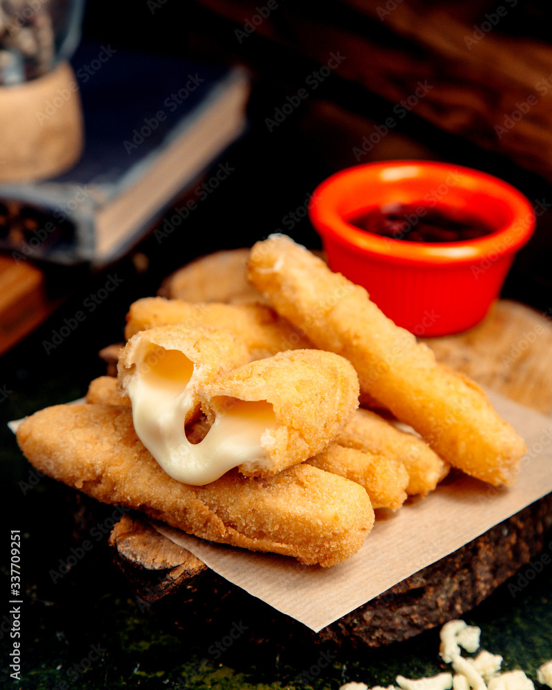 cheese sticks in batter on a wooden hemp cheese sticks in batter on a wooden hemp
