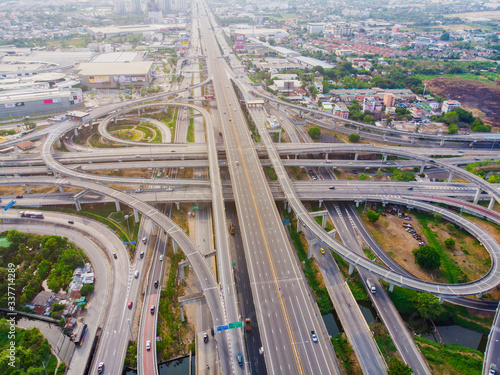 Aerial view elevated city road junction and interchange overpass at day light