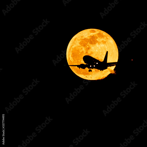 The full moon rising is a beautiful sight. Its orange glow rising