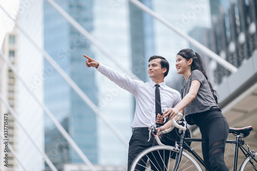 Business men recommend routes for women riding bicycles