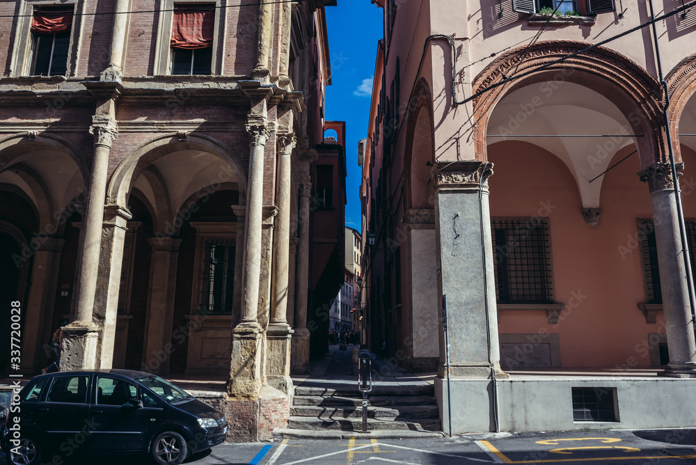 Narrow passage of Monari Street in historic part of Bologna city, Ialy