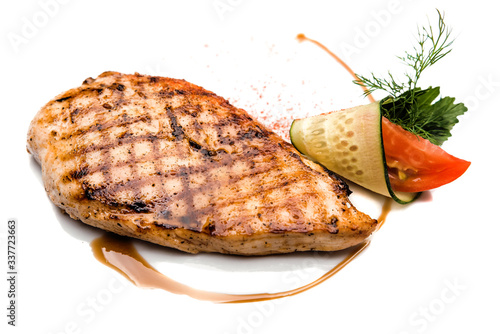 Grilled beef steaks with spices isolated on a white background
