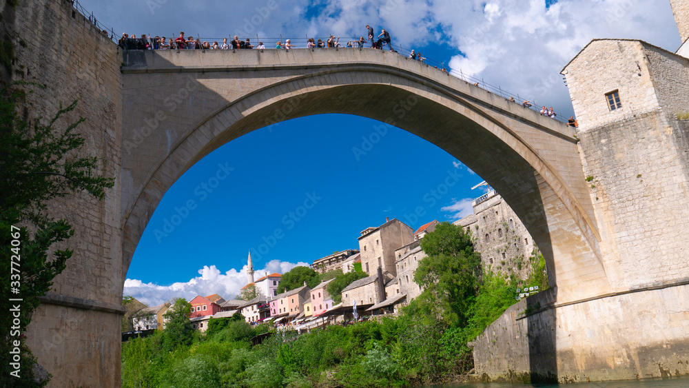 Mostar, Bosnia and Herzegovina, April 2019: Old bridge and Neretva River.