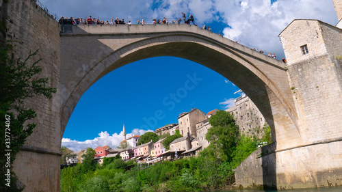 Mostar, Bosnia and Herzegovina, April 2019: Old bridge and Neretva River.