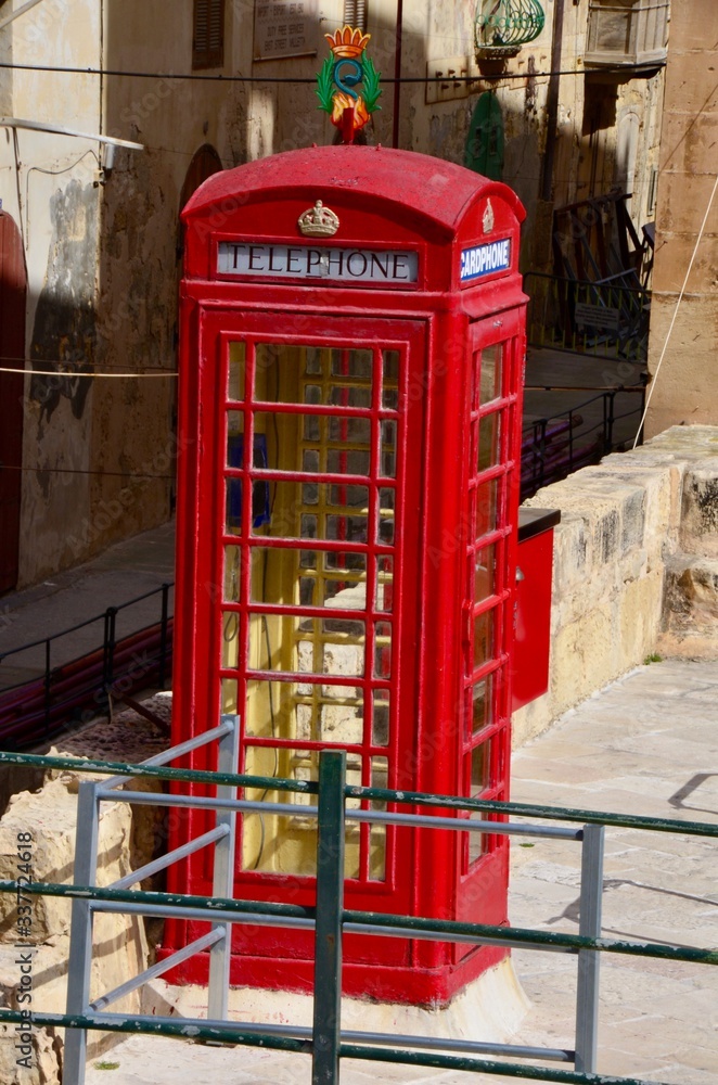 Typical British telephone box in Valletta, Malta Typical British telephone box in Valletta, Malta