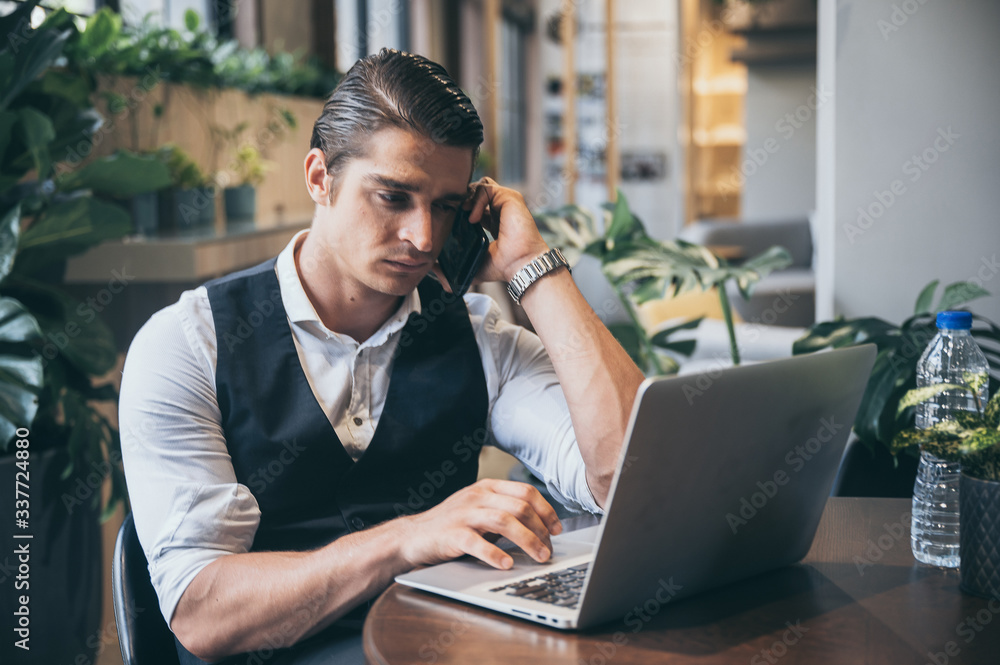 Young unemployed man is looking news for a job in the laptop Young unemployed man is looking news for a job in the laptop