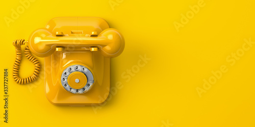 vintage yellow telephone on yellow background. 3d illustration