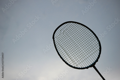 Broken Badminton Racket with Sky Background.Showing Concept of imperfection. © parnupolt