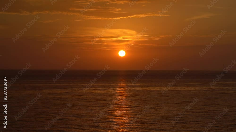 Nature seascape of Tranquil sunset scene. Sun and dark clouds with twilight sky over the sea at phuket Thailand - image backdrop background and copy space Nature seascape of Tranquil sunset scene. Sun and dark clouds with twilight sky over the sea at phuket Thailand - image backdrop background and copy space