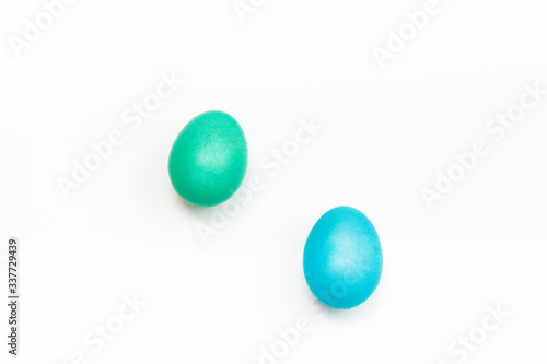 Easter multicolor eggs isolated on a white background. Rainbow. Copy space. Flat lay. Top view.